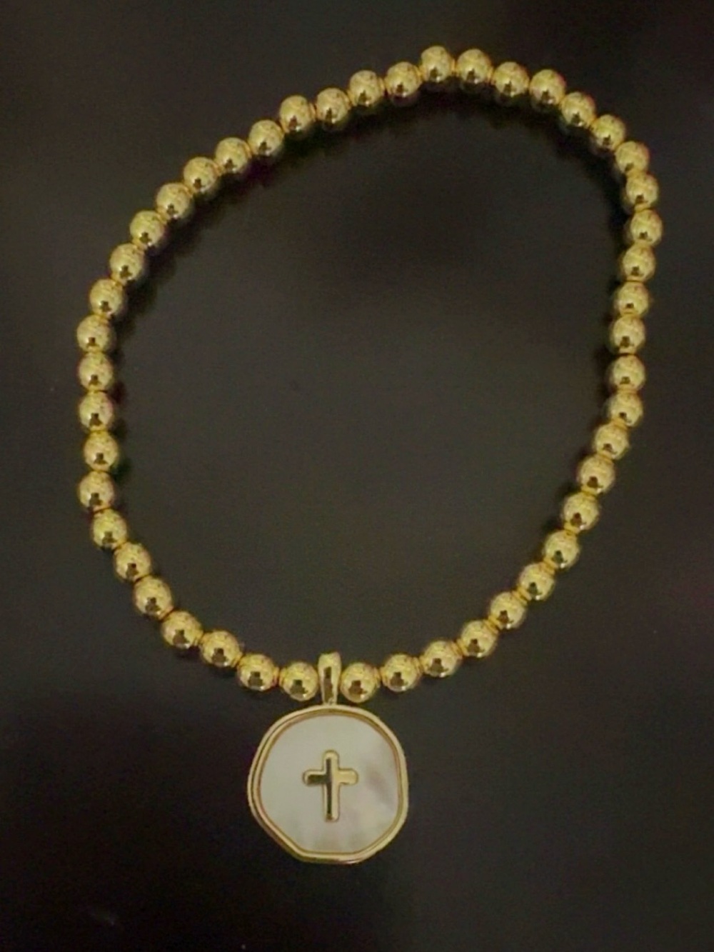 Gold beaded bracelet with cross charm, never worn, brand new